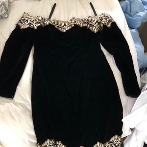 Black velvet off the shoulder long sleeved dress